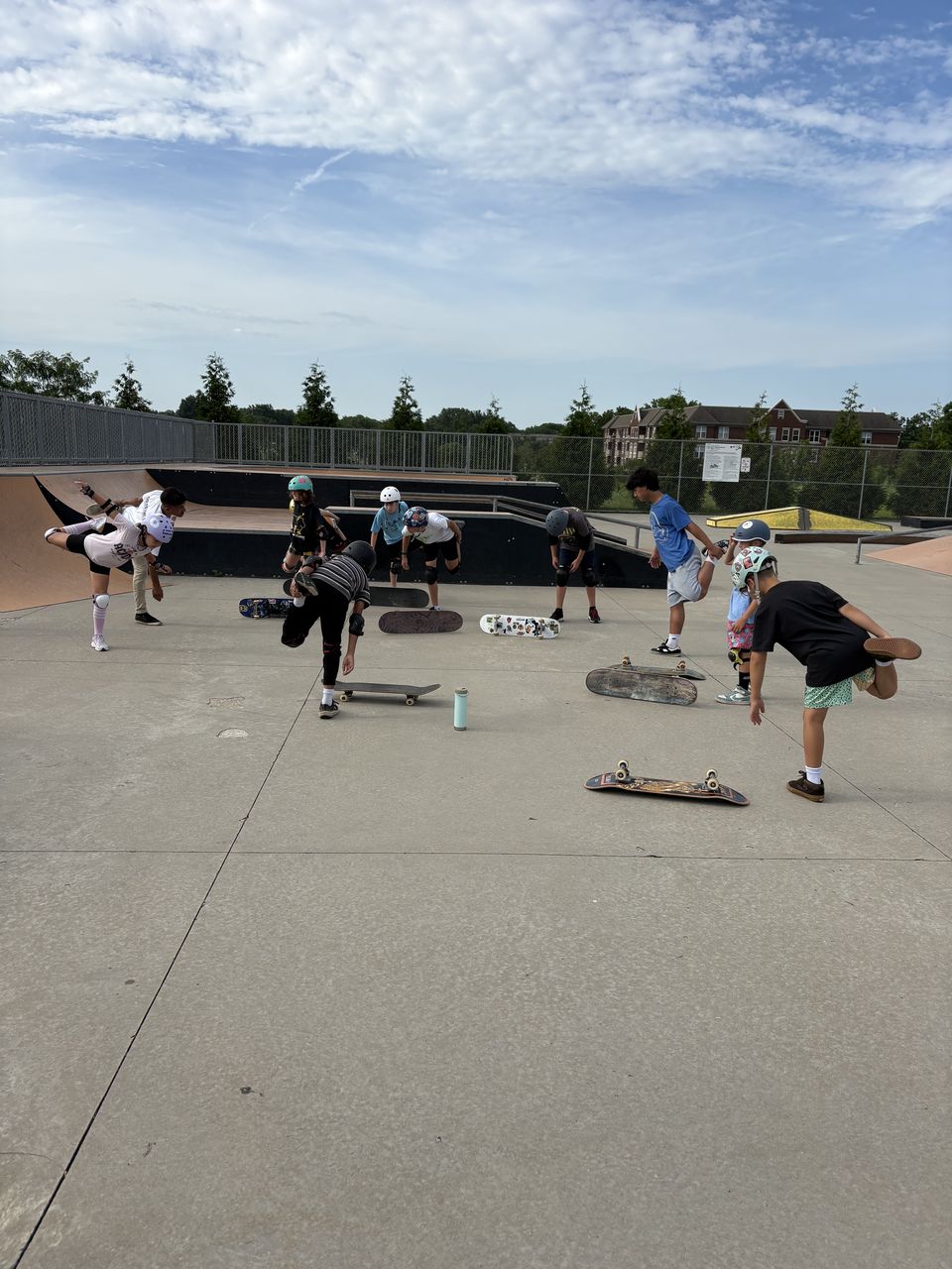 Skate Lessons Chicago students stretching before class at Palatine Prairie Skatepark